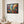 Vibrant geometric abstract canvas in a black frame in a luminous living space | MusaArtGallery