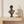 Black and gold David bust sculpture on a travertine console | MusaArtGallery