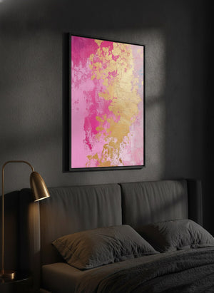 Golden Bloom pink and gold abstract canvas art in a black frame, hung above a bed in a dark modern bedroom | MusaArtGallery™