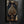 Luxurious Ace of Spades canvas art in a black floating frame, hung above a walnut cabinet with a whisky decanter in a dark man cave | MusaArtGallery™