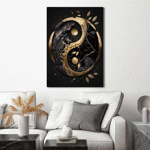 Decorative wall art with a yin yang symbol in gold and black on a white wall above a sofa.