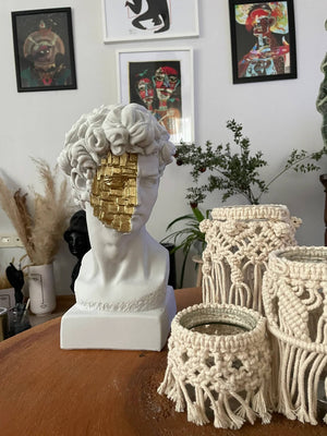 David White and Gold Bust Statue