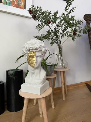 David White and Gold Bust Statue