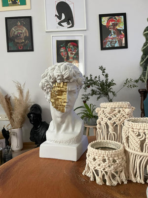 David White and Gold Bust Statue