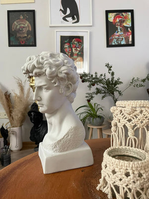 David White and Gold Bust Statue