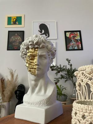 David White and Gold Bust Statue