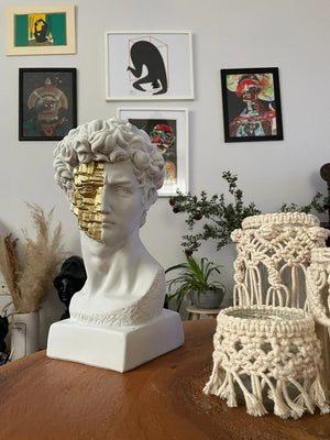 David White and Gold Bust Statue